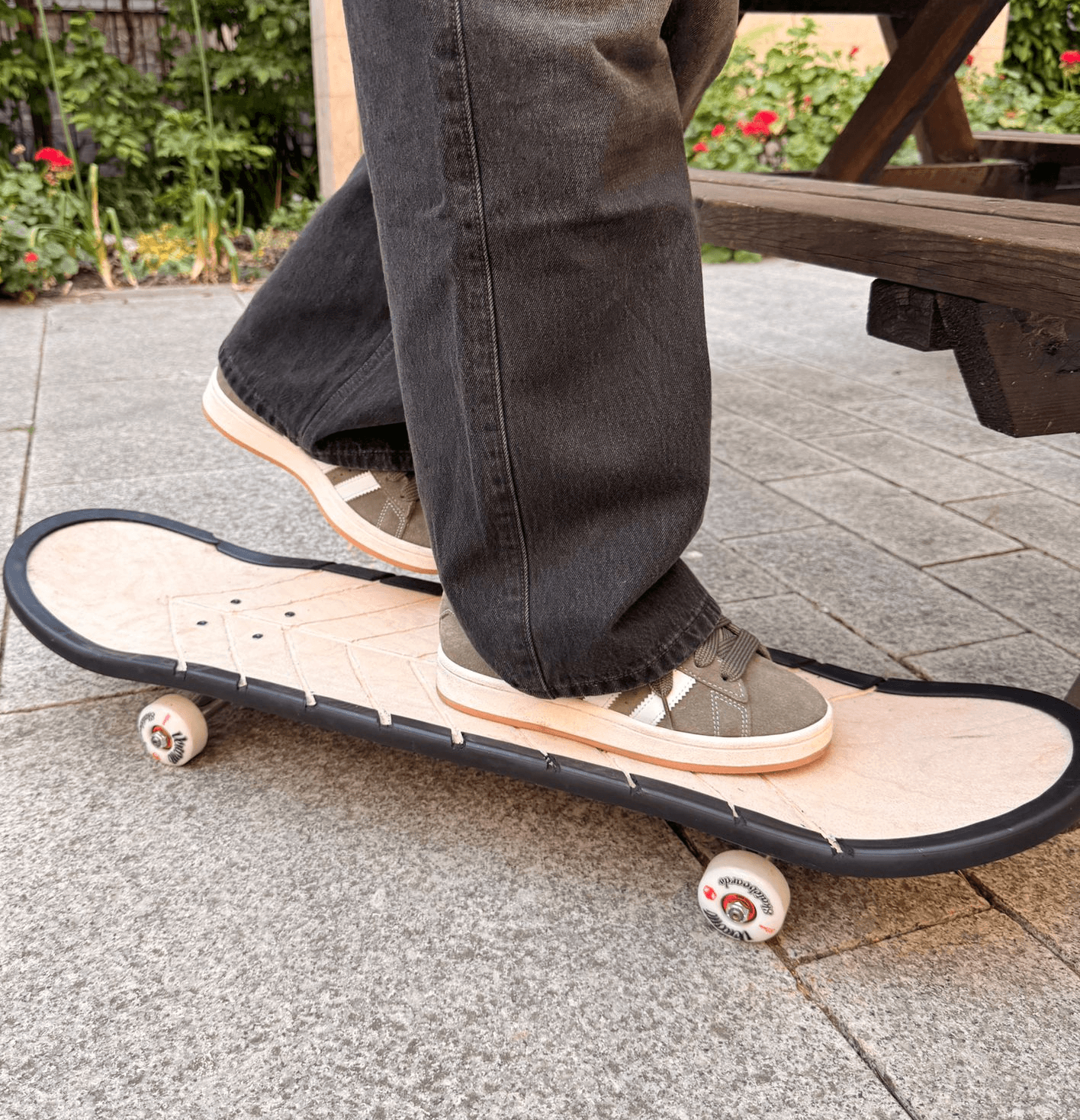 A rider standing on the completed wet-weather skateboard