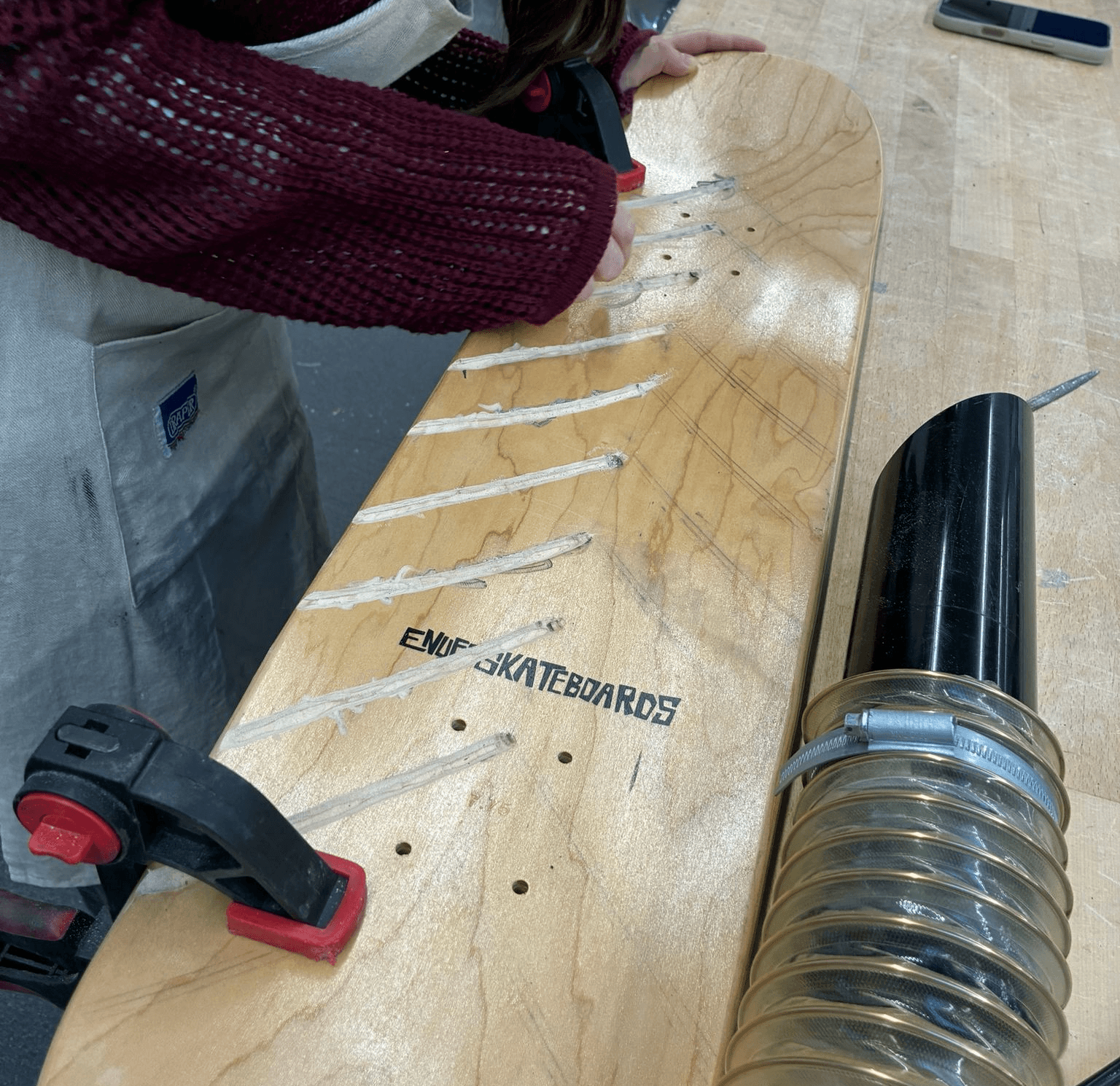 Drainage channels being formed in the skateboard deck