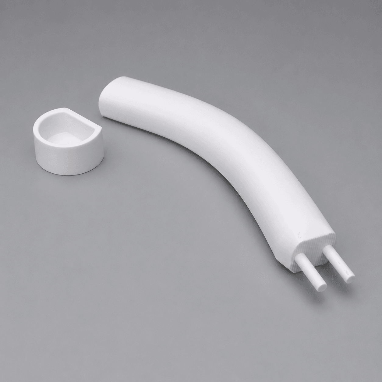 White CAD render of the handle and separate attachment component